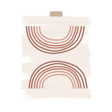 Load image into Gallery viewer, An art print featuring two ombre pink rainbows with one upside down hung with a piece of kraft tape on the top.