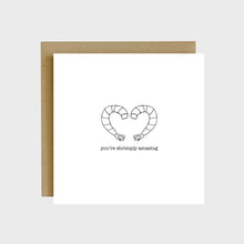 Load image into Gallery viewer, A funny greeting card featuring two pieces of headless and peeled shrimp and text that reads, you're shrimply amazing.