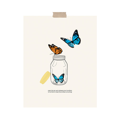 An art print featuring three orange and blue butterflies flying out of a mason jar hung with a piece of kraft tape on the top.