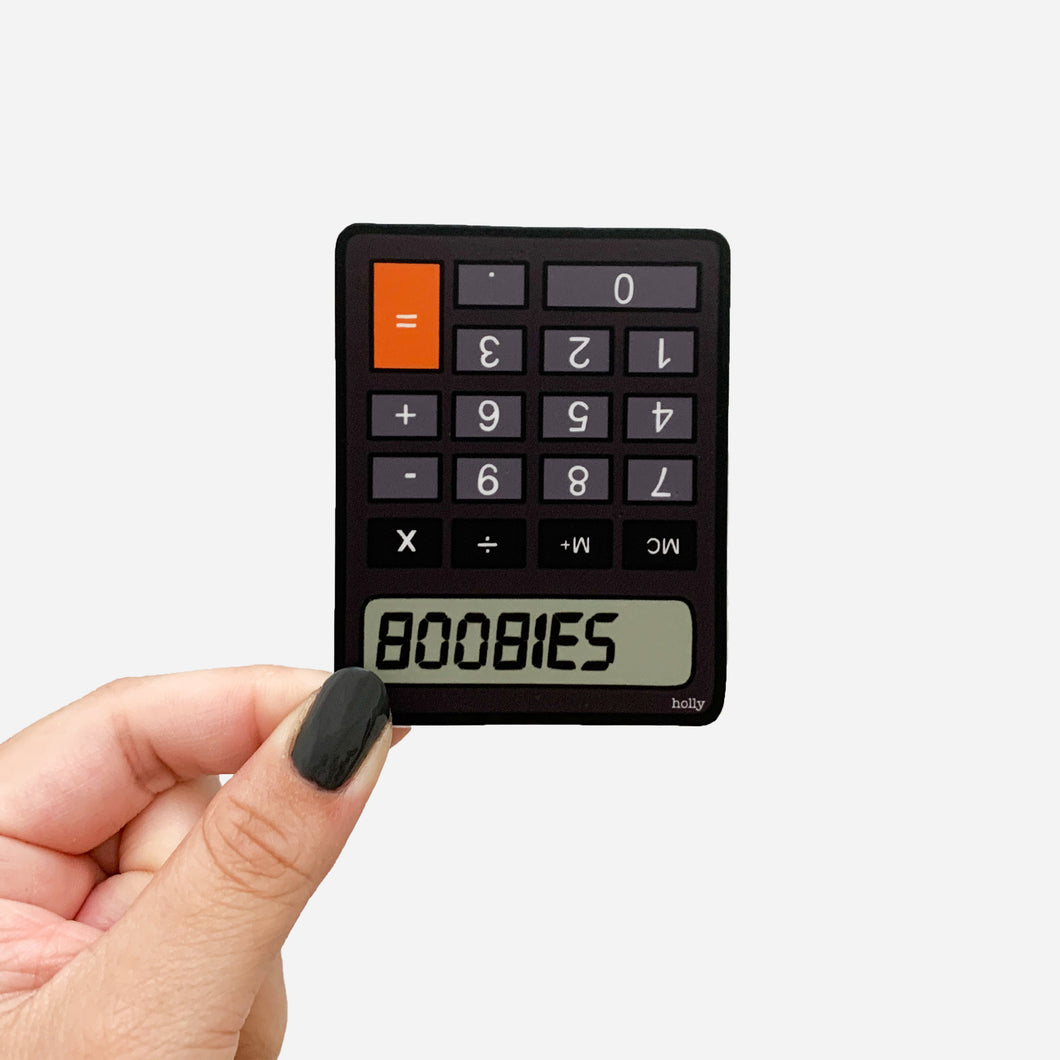 A funny sticker featuring a calculator upside down and numbers that create text that reads, BOOBIES.