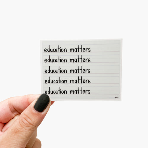 A sticker featuring lined paper and text that reads, Education matters.