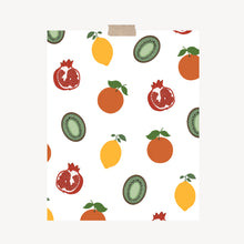 Load image into Gallery viewer, An art print featuring scattered fruits, including an orange, pomegranate, kiwi, and lemon hung with a piece of kraft tape on the top.
