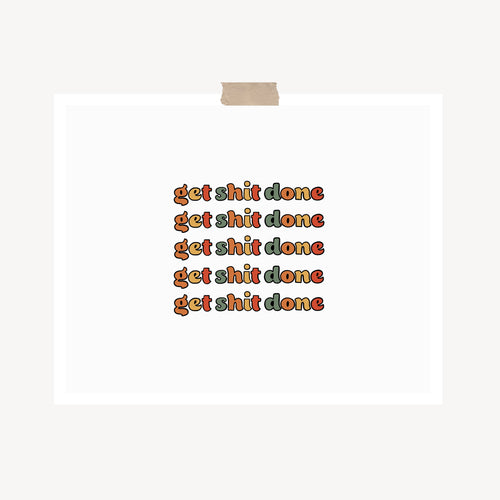 An art print featuring the text, “Get shit done,” written in retro bubble text and muted colors hung with a piece of kraft tape on the top.