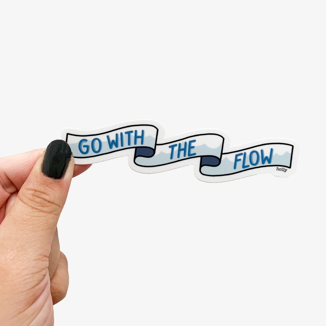 A sticker featuring a banner with waves in them and text that reads, Go with the flow.