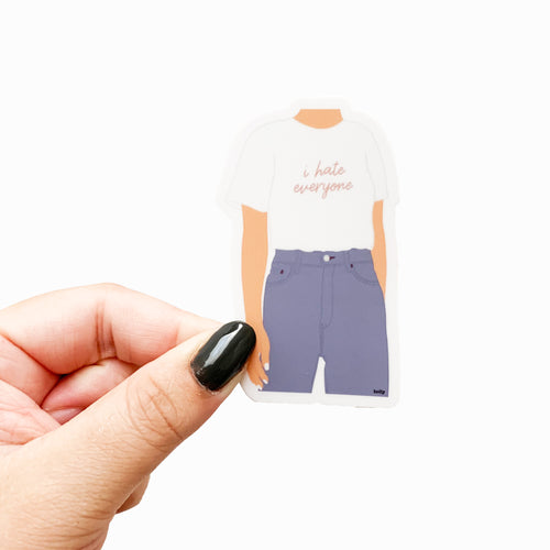 A funny sticker featuring a woman wearing blue jeans and a white t-shirt with text that reads, I hate everyone.