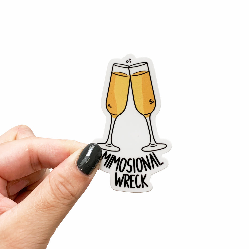 A funny sticker featuring two champagne glasses with mimosas in them and text that reads, Mimosional wreck.