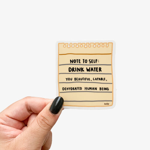 A funny sticker featuring a ripped piece of yellow notepad paper and text that reads, Note to self: drink water you beautiful, capable, dehydrated human being.