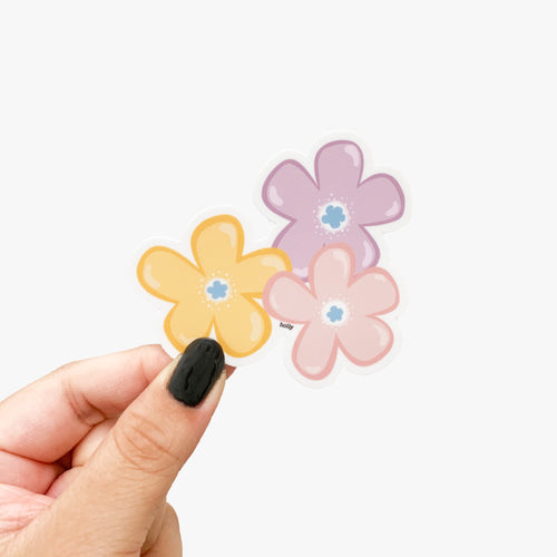 A sticker featuring a pink, purple, and yellow flower together.