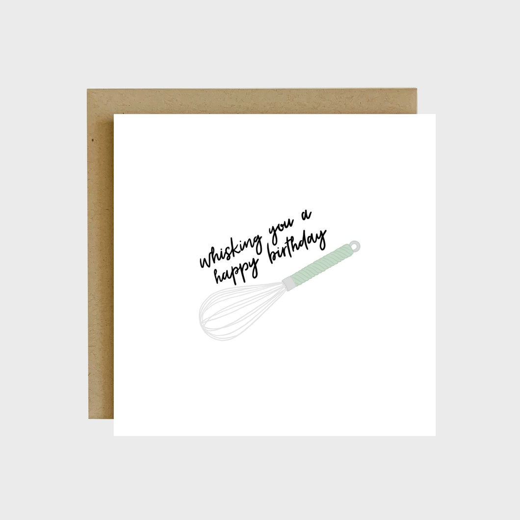 A funny greeting card featuring a silver whisk with a mint colored handle and text that reads, Whisking you a happy birthday.