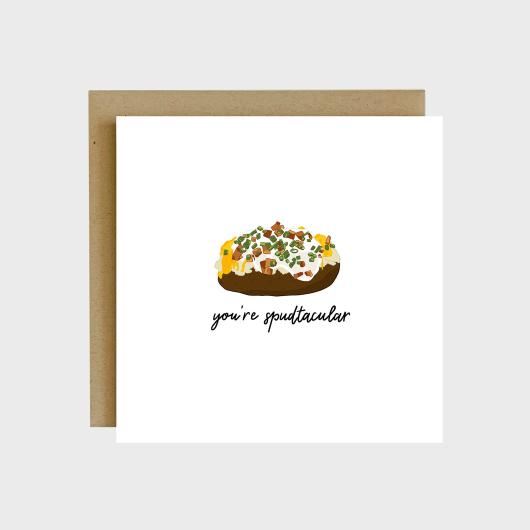 A funny greeting card featuring a baked potato with cheese, sour cream, bacon, and green onions on top and text that reads, You’re spudtacular. 