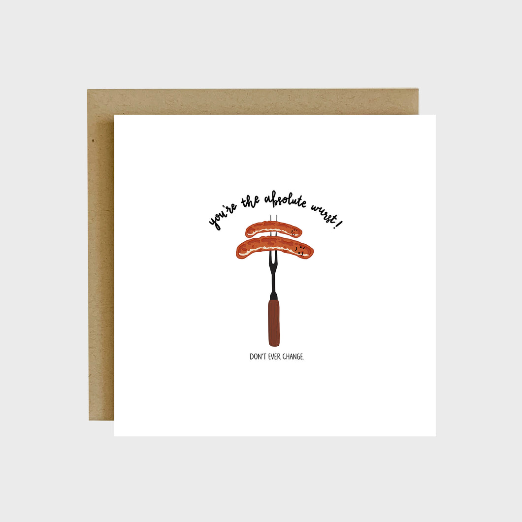 A funny greeting card featuring two bratwurst sausages on a grill fork and text that reads, You’re the absolute wurst, don’t ever change.